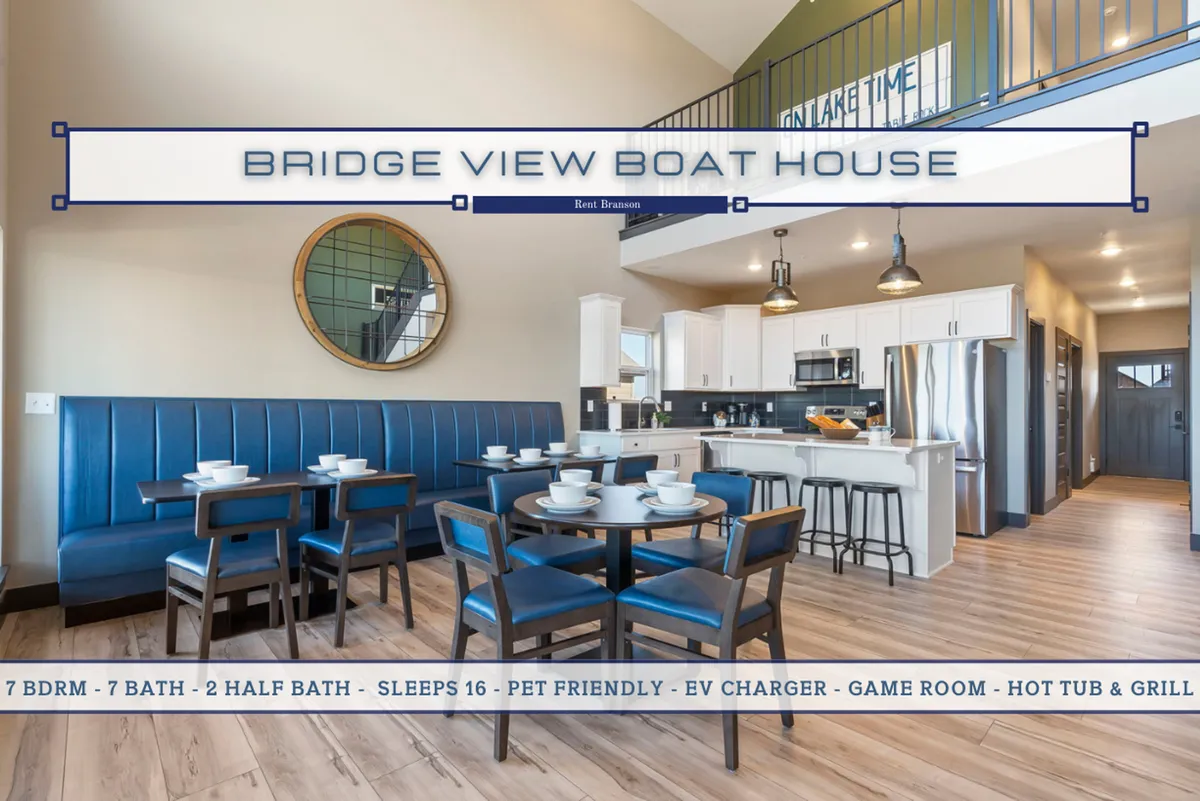 The inviting interior of the home features blue upholstered seating, a large round mirror, an open kitchen, and a dining table, all set in a fresh, modern style. The space is ideal for family gatherings, game nights, or simply relaxing in a sparkling, newly furnished environment.